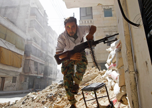 War in Syria man with automatic riffle Photo by Goran Tomase